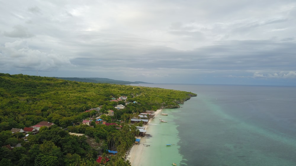 an aerial view of a beach and a tropical island