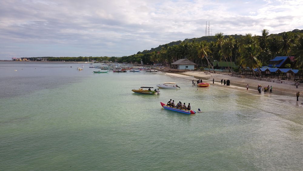 a group of people on a boat in the water