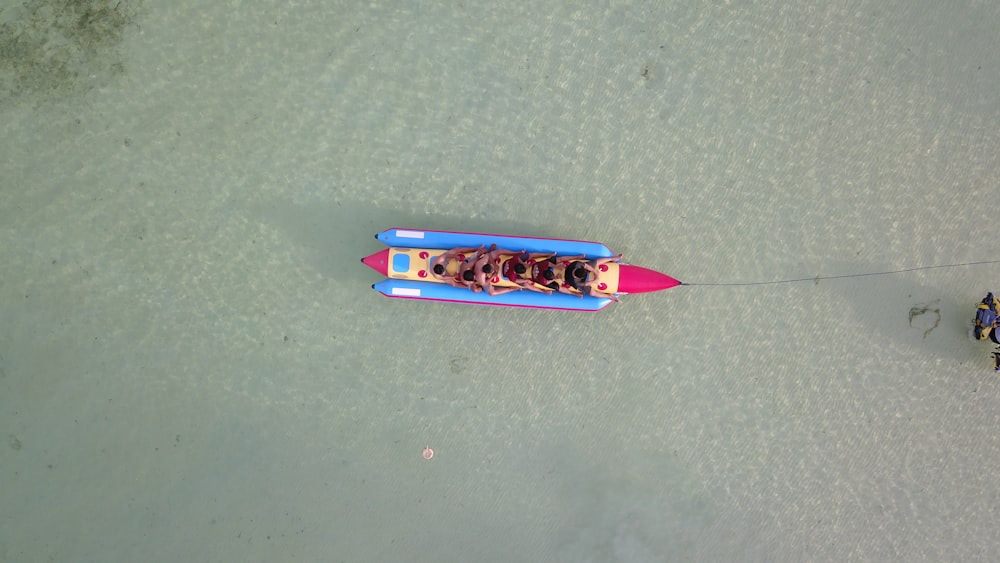 two people in a boat on a body of water