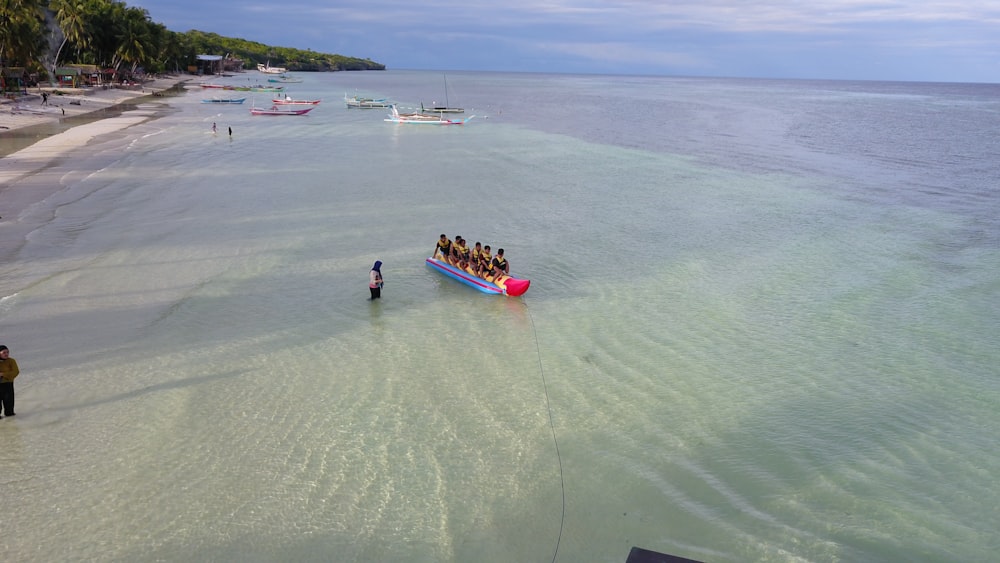 a group of people on a boat in the water