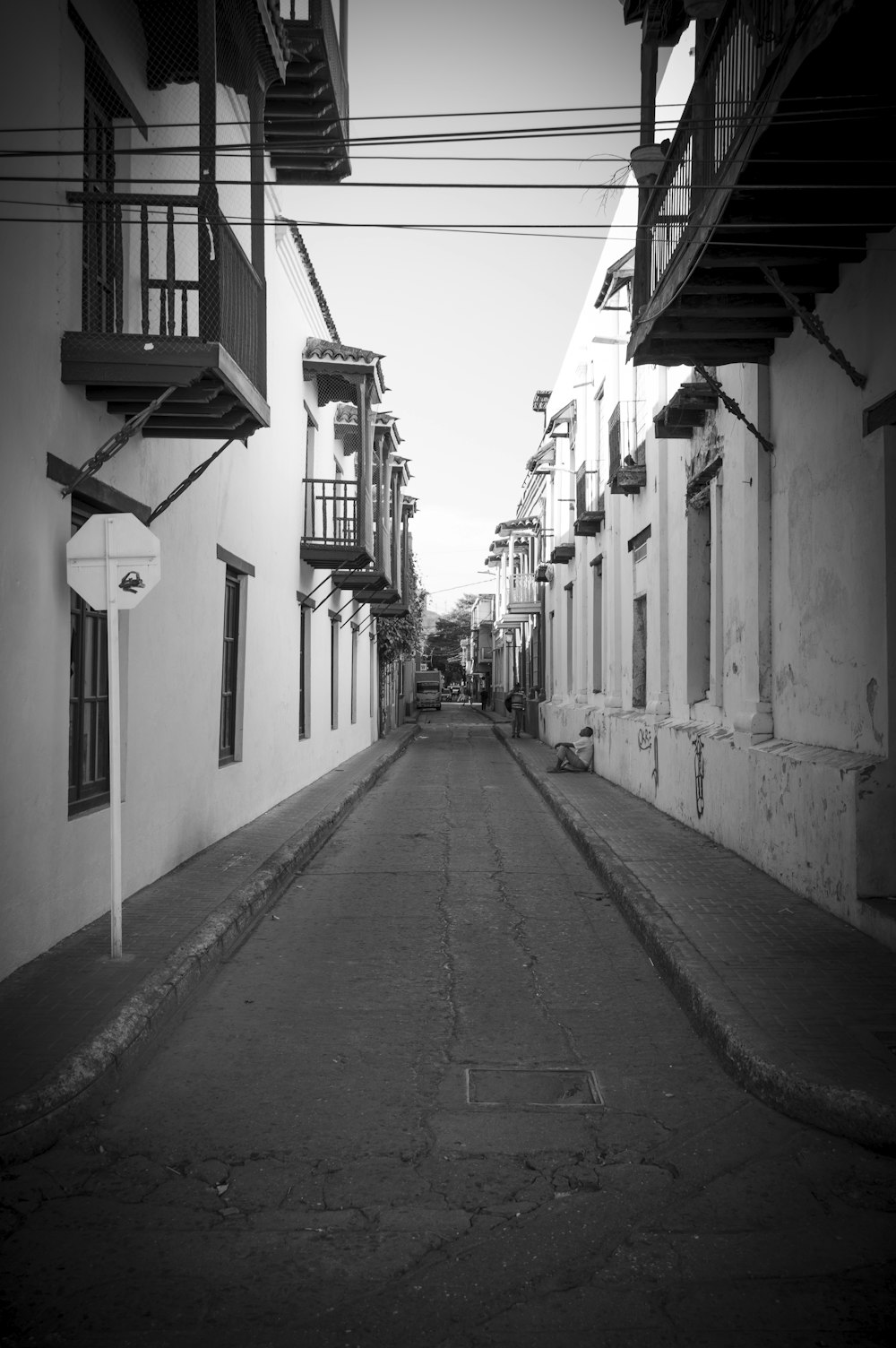 a black and white photo of an empty street
