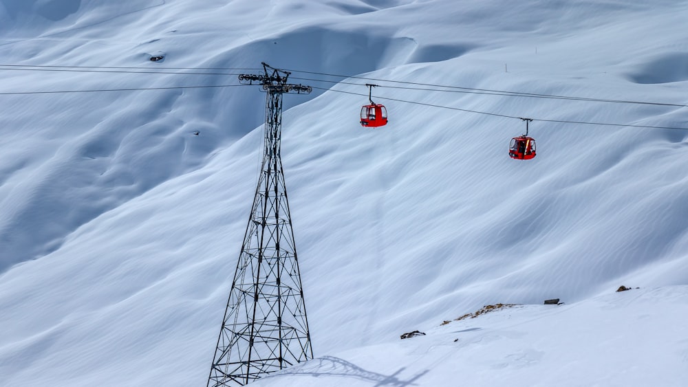 a ski lift going up a snowy mountain