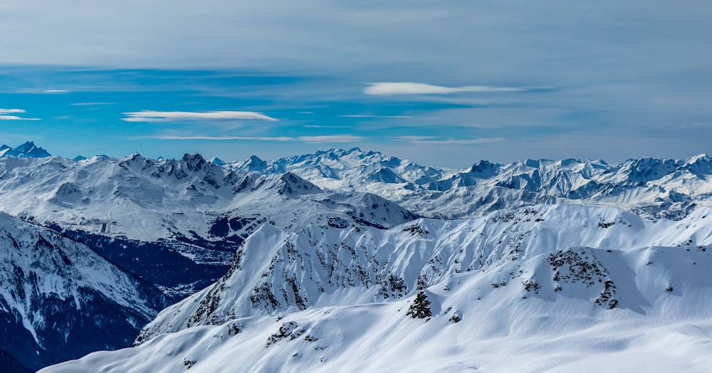 a view of a mountain range covered in snow