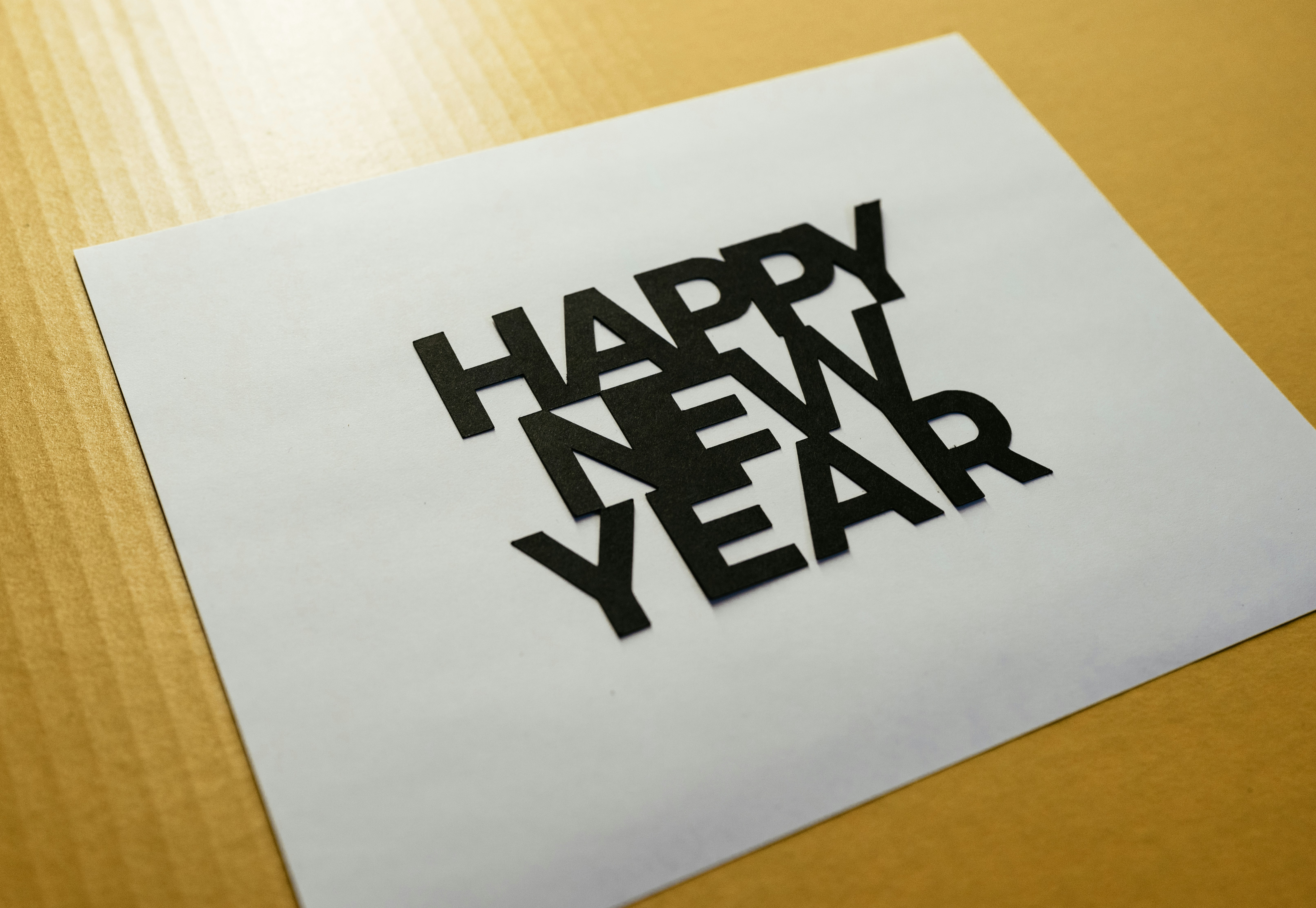 Happy New Year cut out on a piece of paper