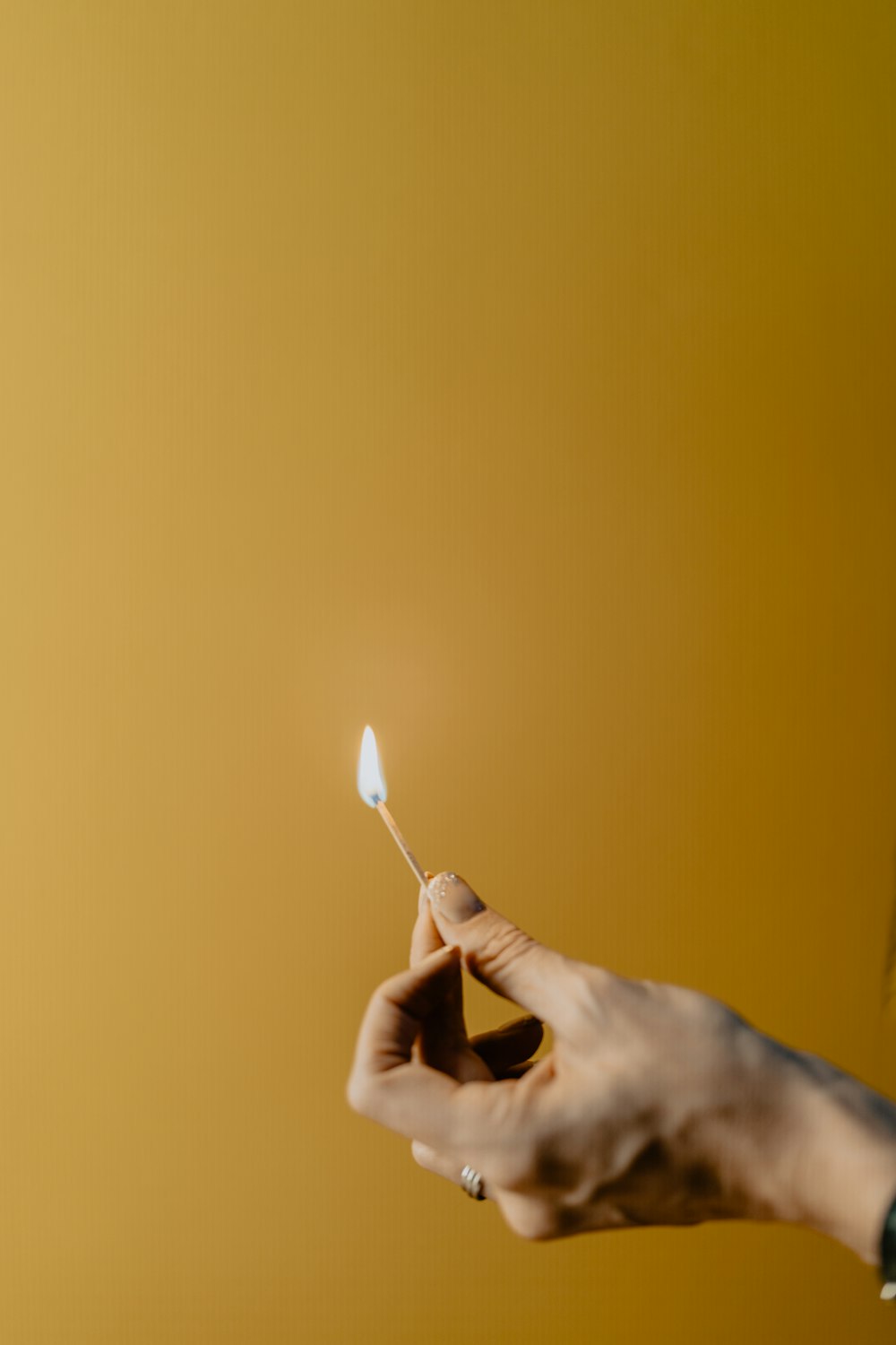 a person holding a toothbrush in their hand