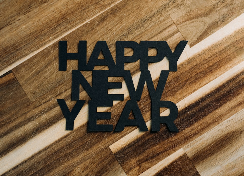 a wooden floor with the words happy new year on it