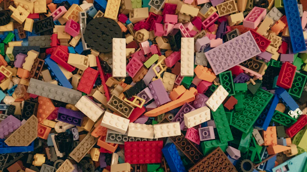 A colorful display of LEGO sets ranging from preschool blocks to intricate adult models.