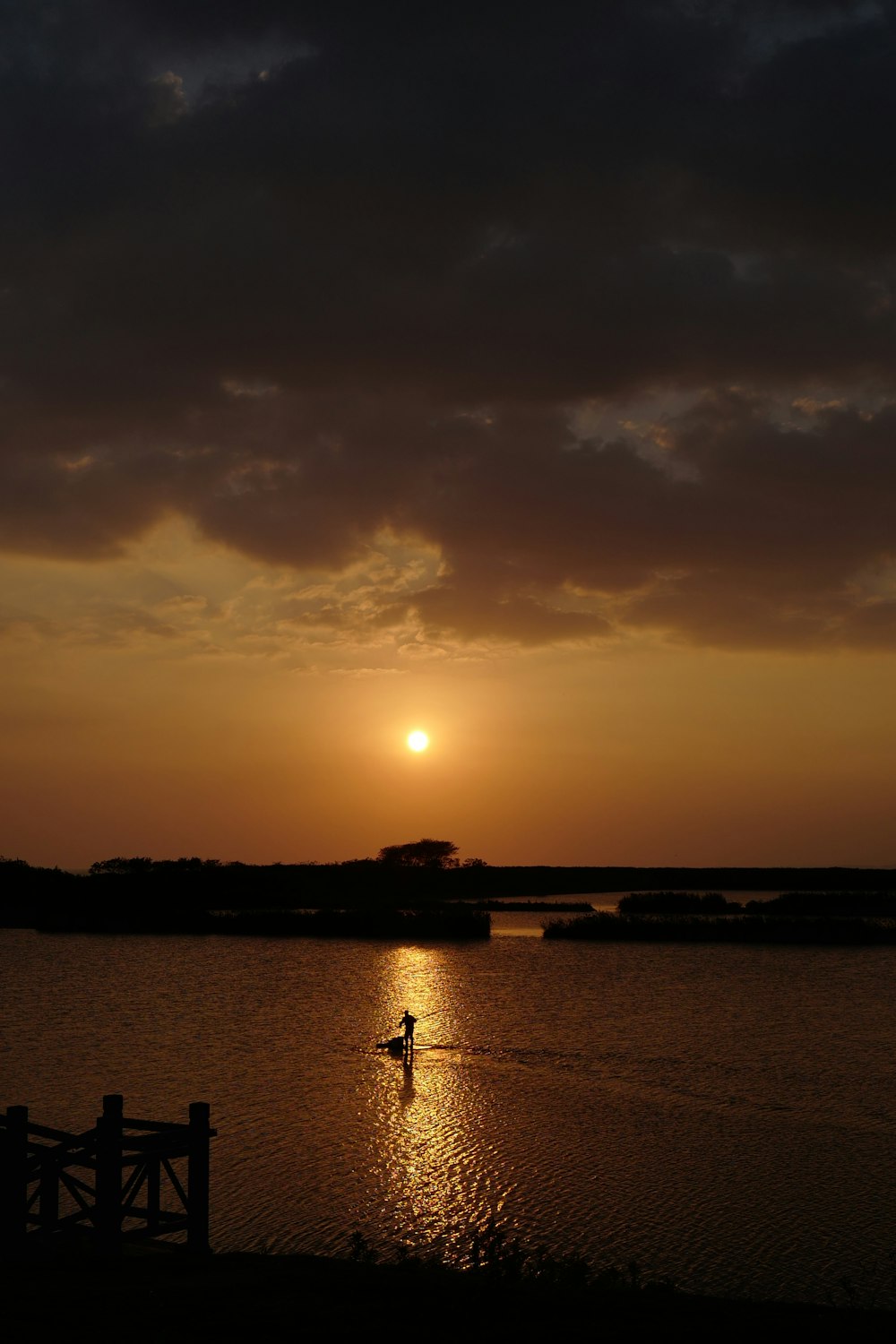 a person riding a surfboard on a body of water