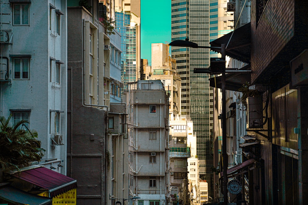 a city street filled with tall buildings next to tall buildings