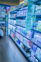 Shelves stocked with pharmaceutical products and medical supplies in a modern pharmacy.