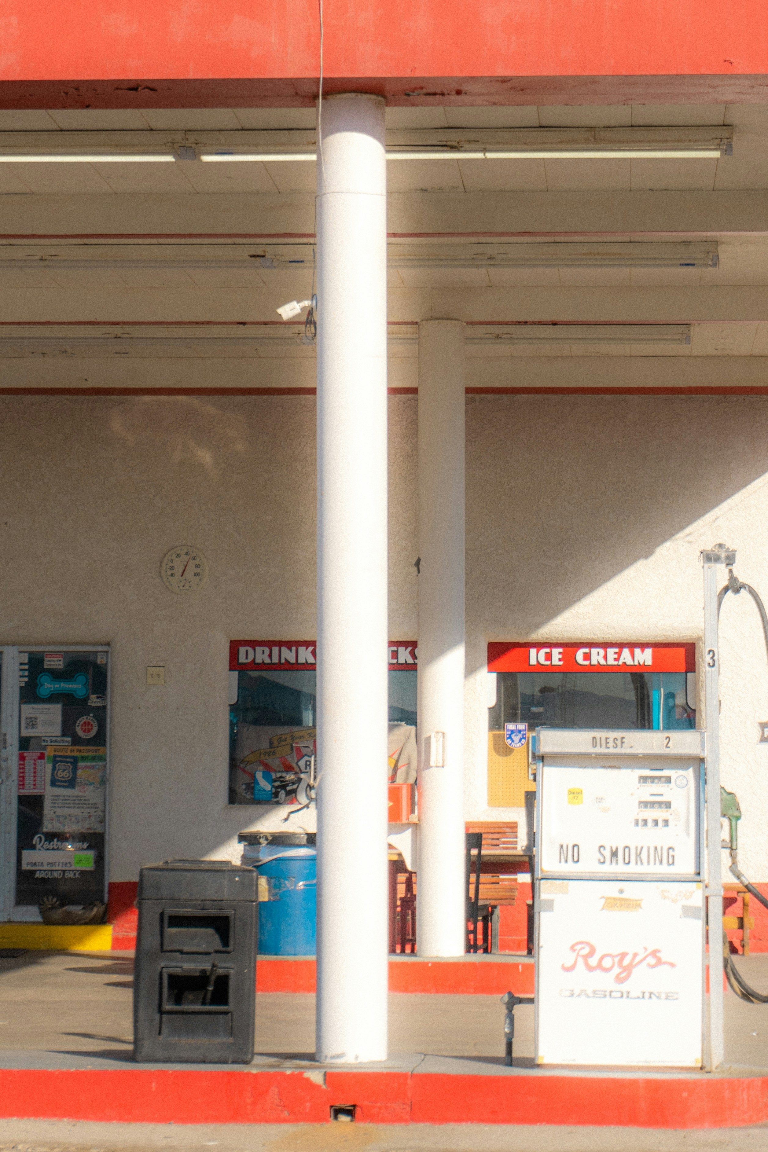 a gas station with a gas pump next to it