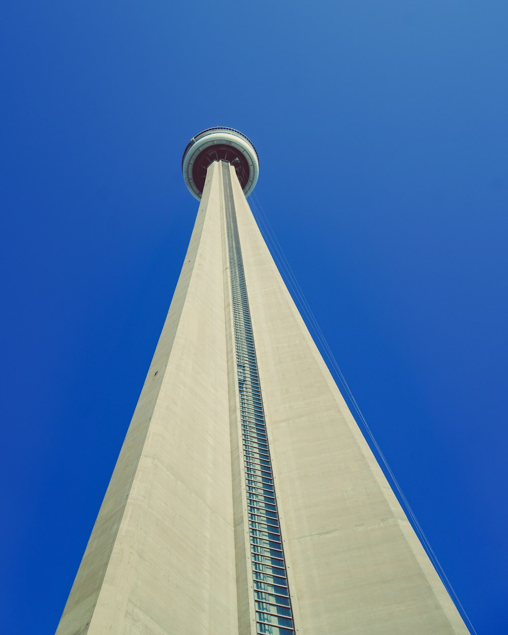 the top of a tall building with a sky background