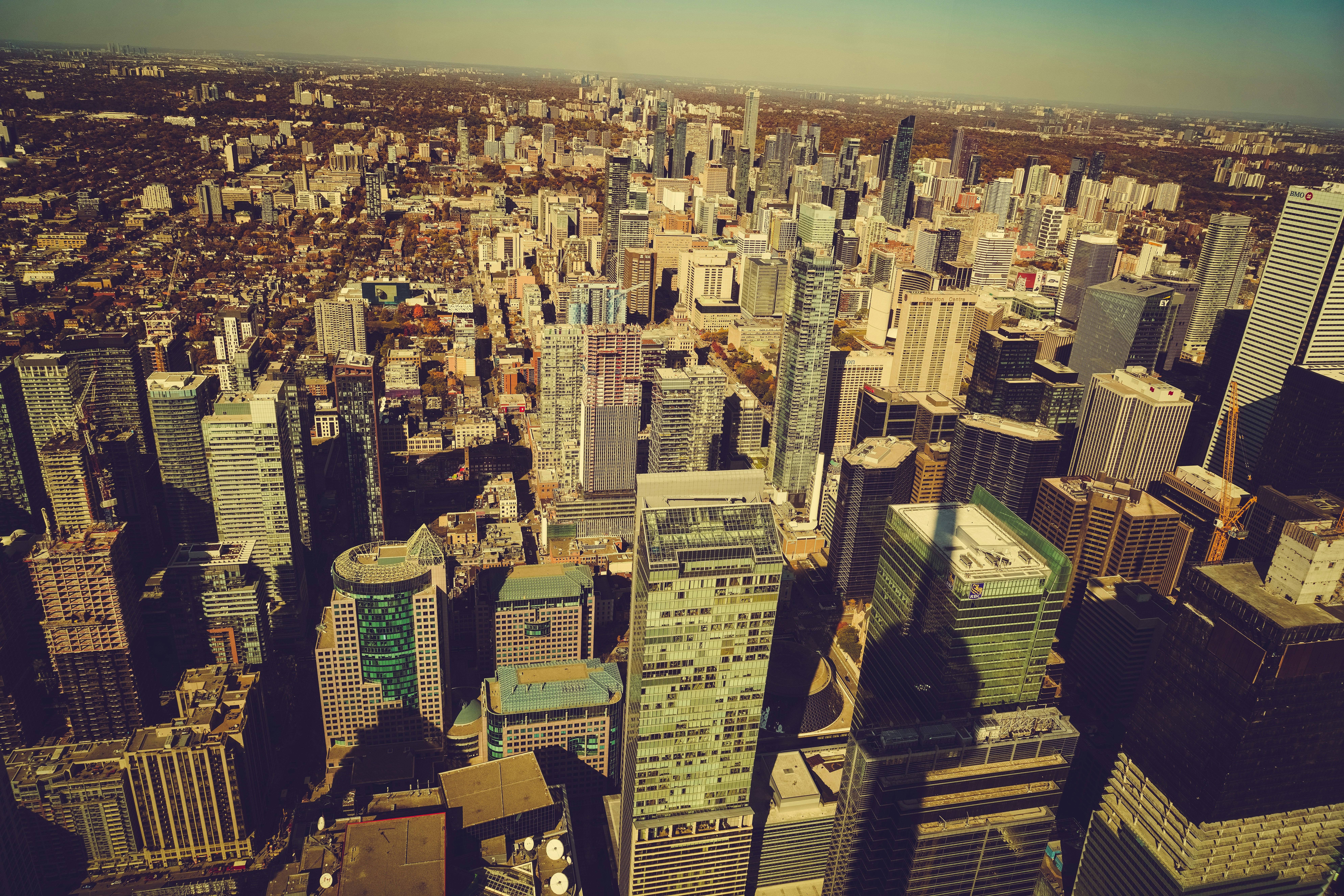 an aerial view of a city with tall buildings