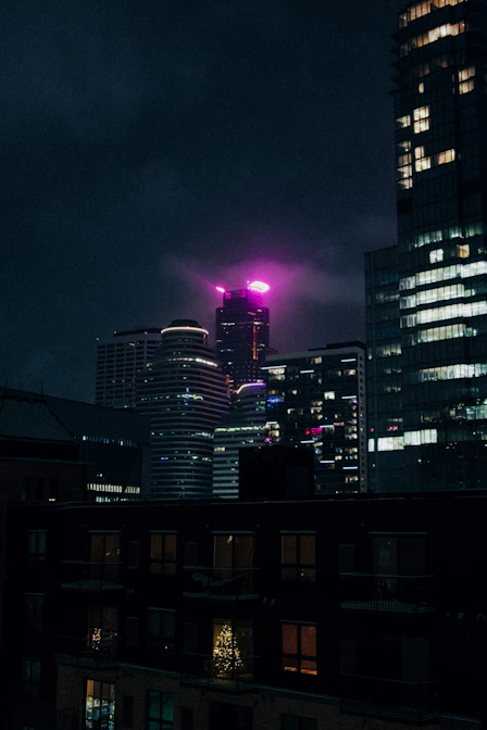 a view of a city at night from a rooftop