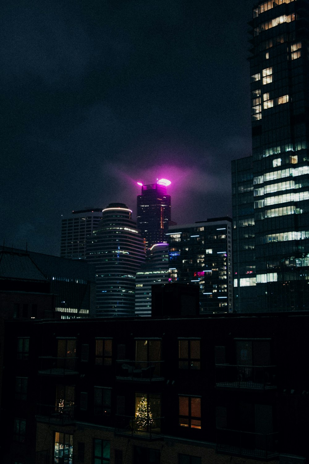 a view of a city at night from a rooftop