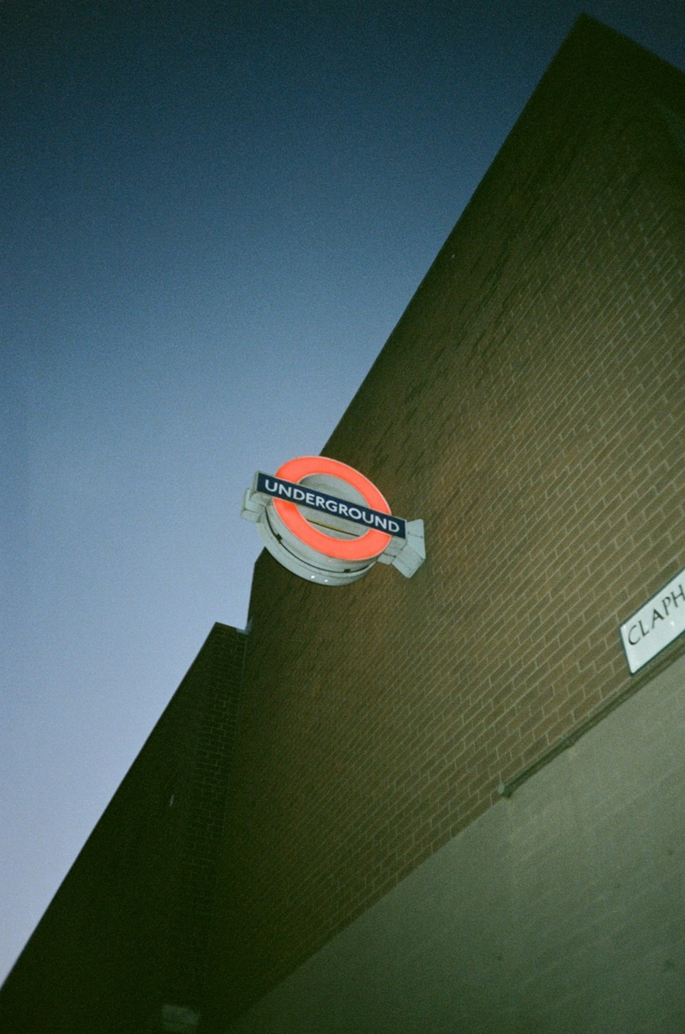 a neon sign on the side of a building