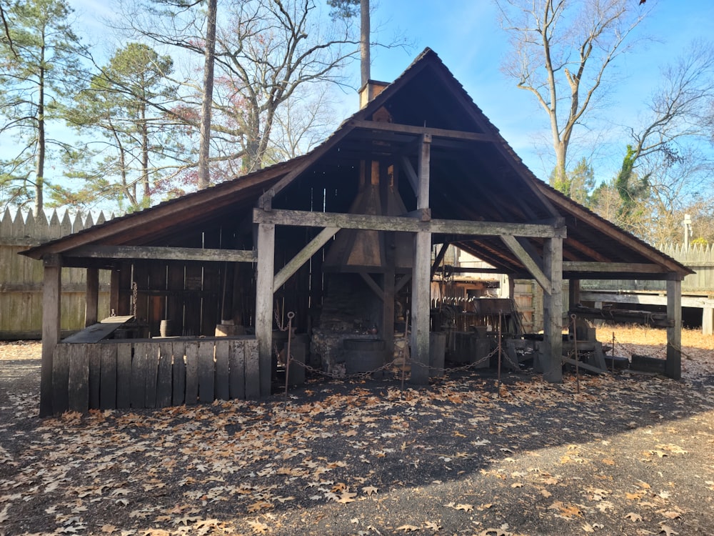 a wooden structure with a fire place in the middle of it