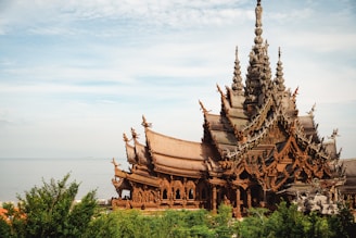 a large wooden building with many spires on top of it