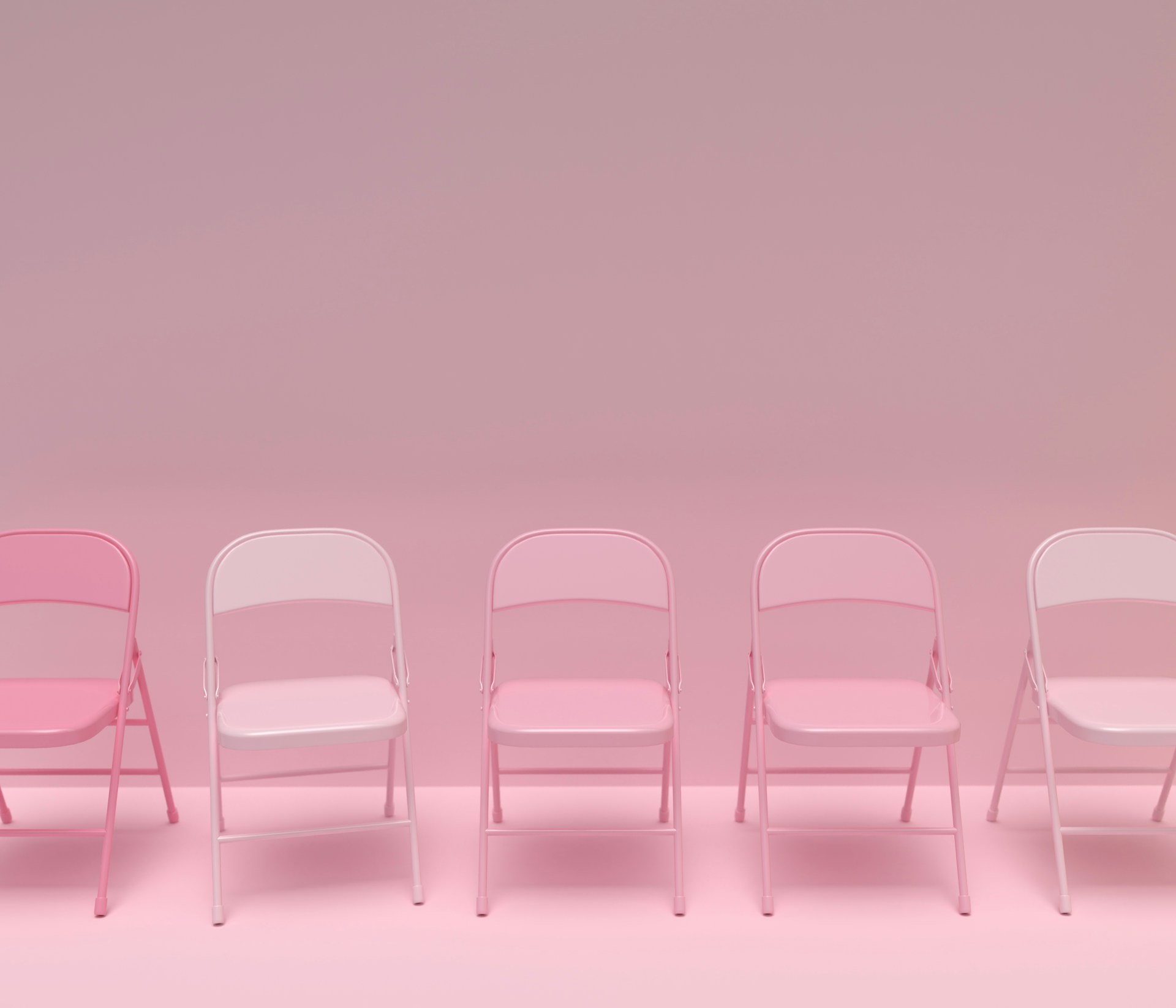 a row of pink and white chairs against a pink background