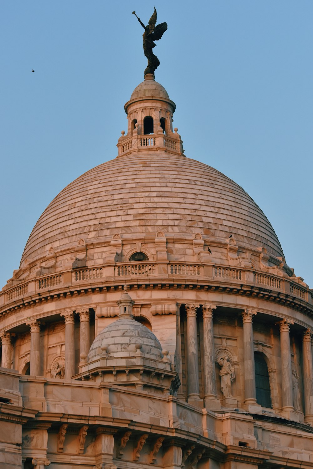 a building with a statue on top of it