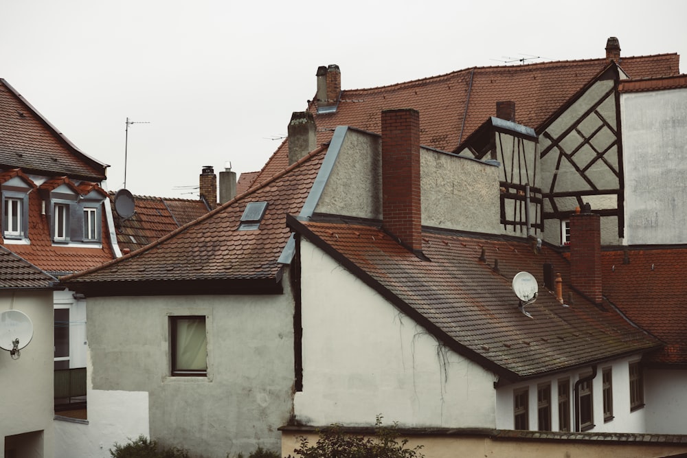 a row of houses with red tiled roofs