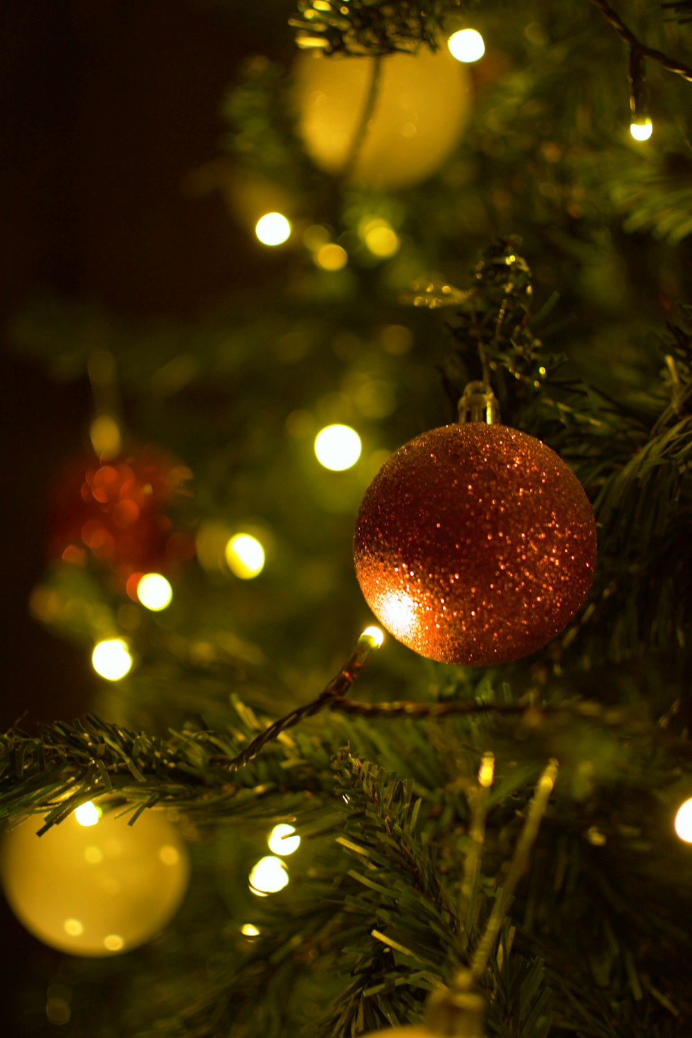 a close up of a christmas tree with lights