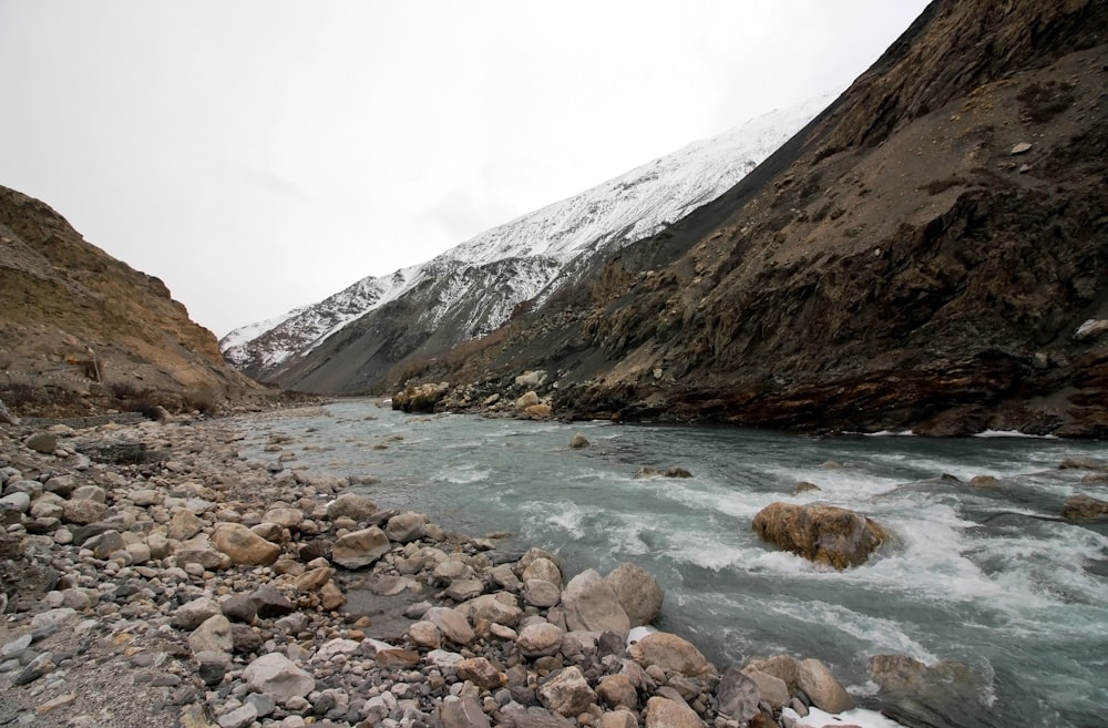 a river running through a rocky mountain valley