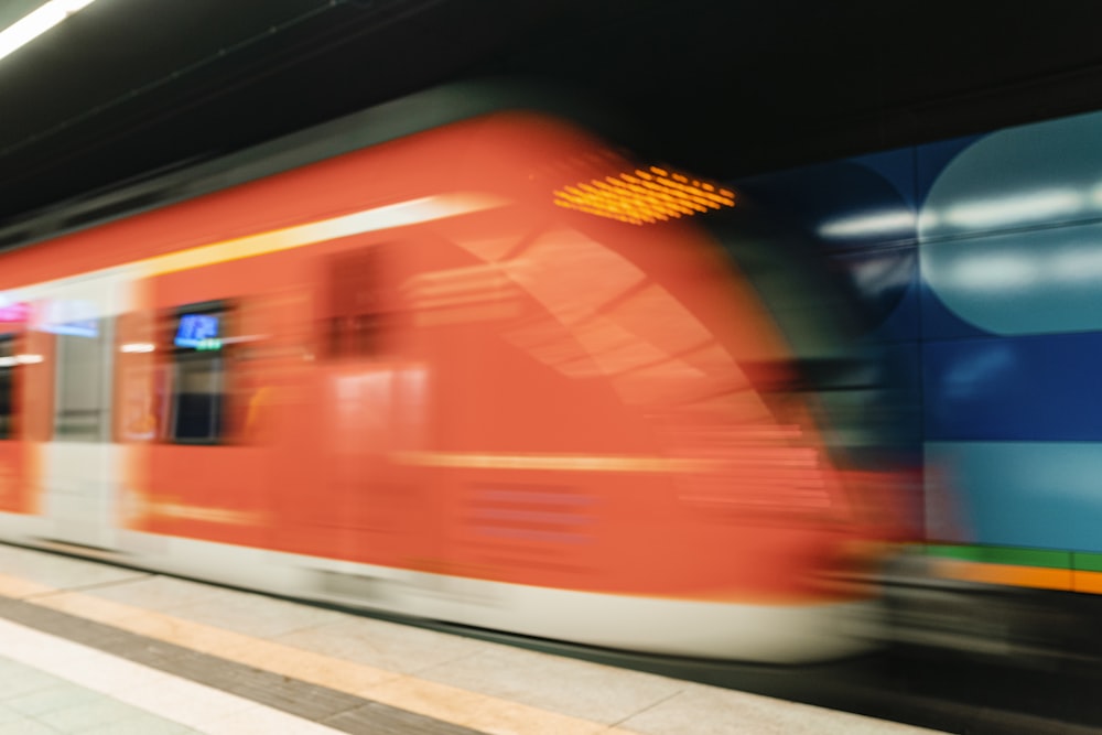 a blurry photo of a train coming in to a station