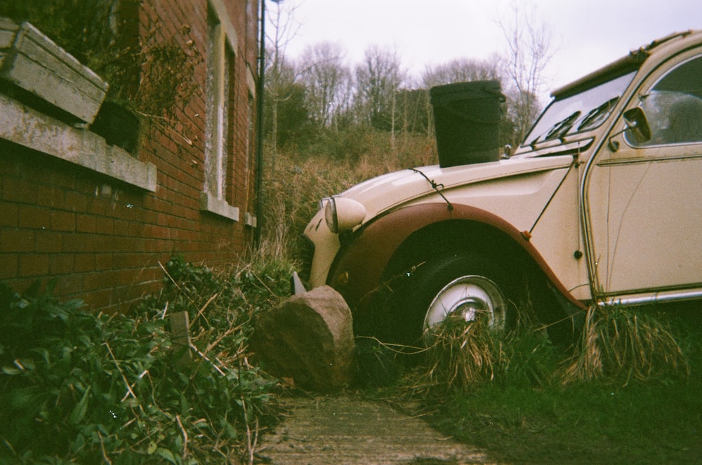 a car that is sitting in the grass