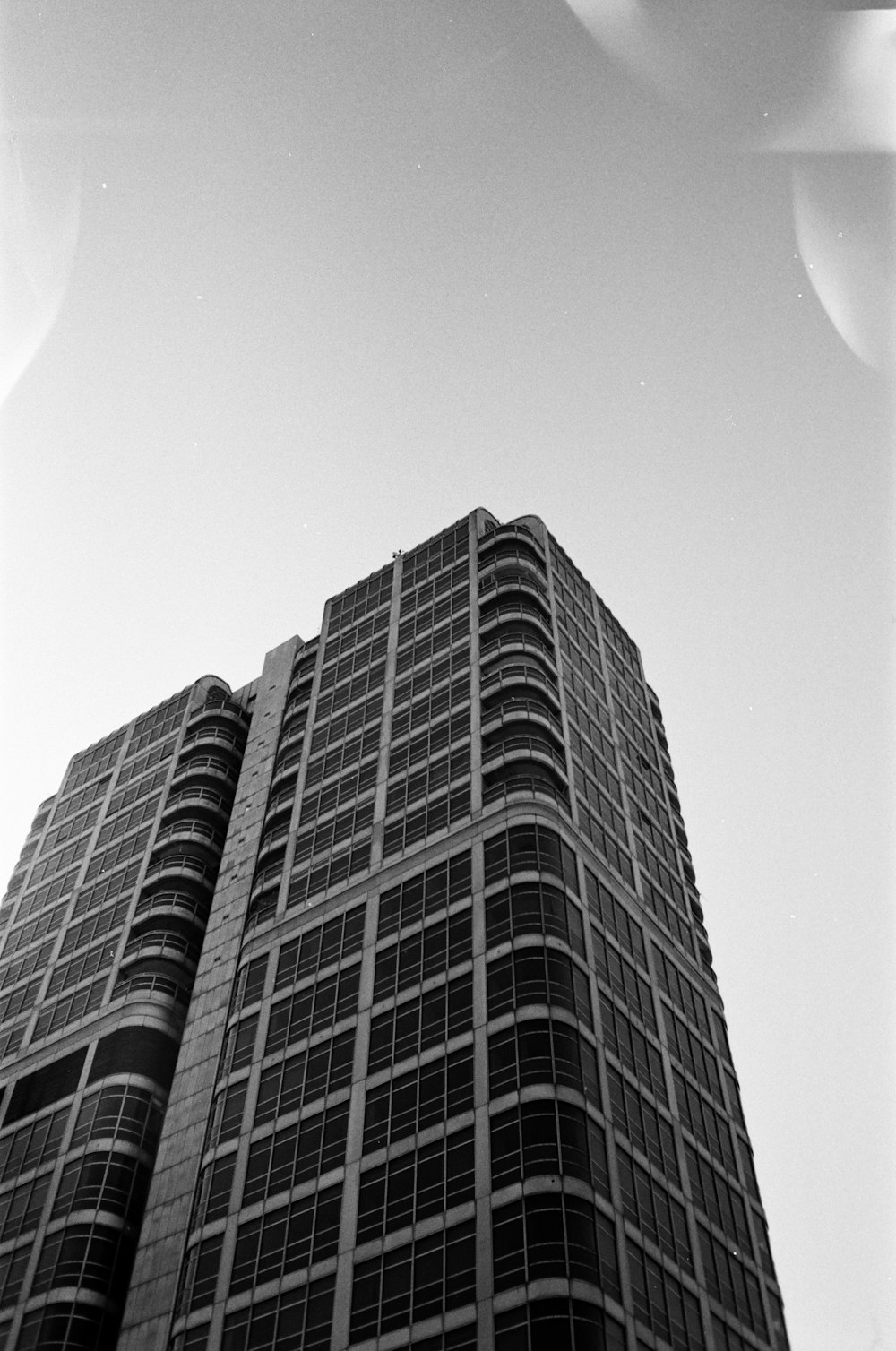 a black and white photo of a tall building