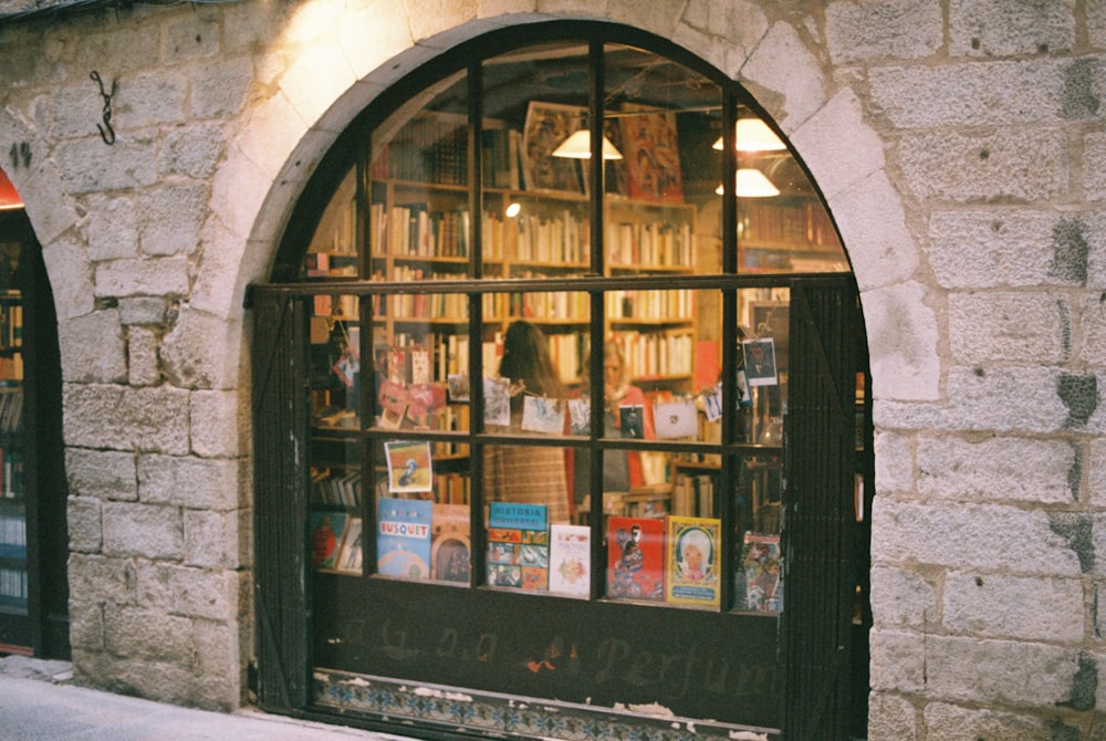 a book store with a large arched window