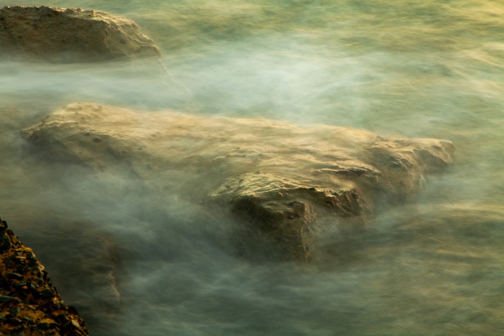 a long exposure of water flowing over rocks