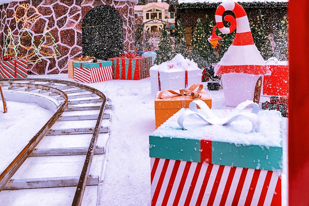 a christmas display with presents and a santa hat