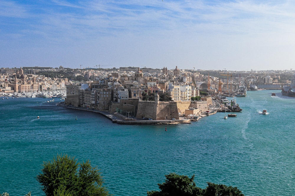 a large body of water with a city in the background