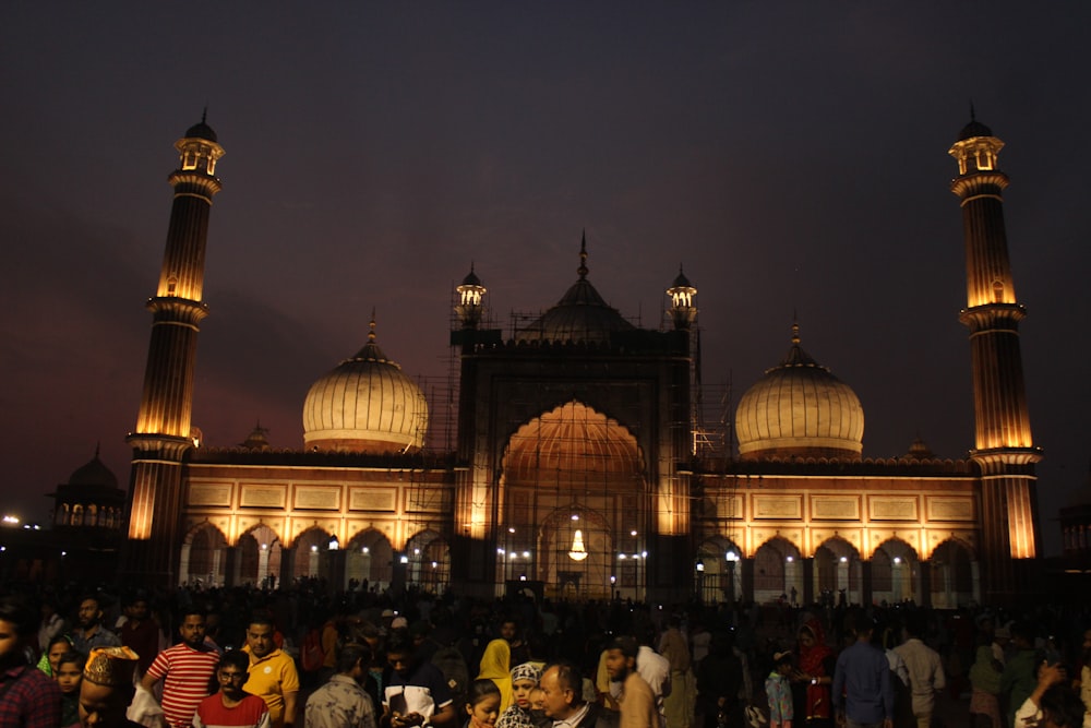 a large group of people standing in front of a building