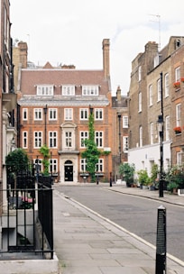 A charming two-bedroom flat with large windows overlooking a quiet London street.