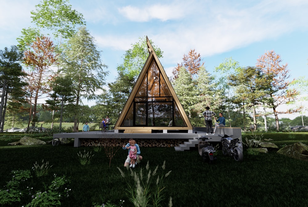 a small triangular shaped house in the middle of a forest