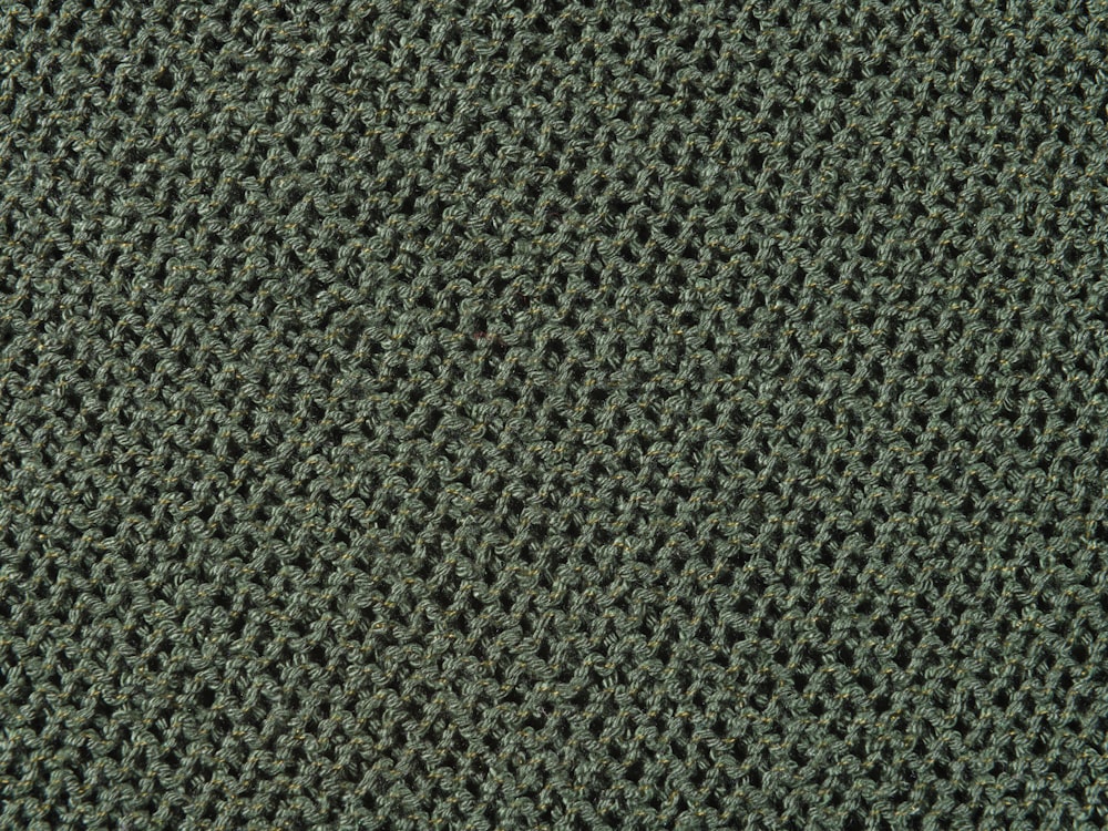 a close up view of a green carpet