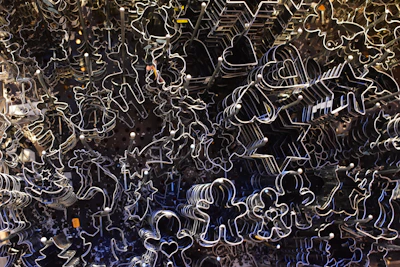 A set of cookie cutters inspired by famous movie icons arranged on a white background.