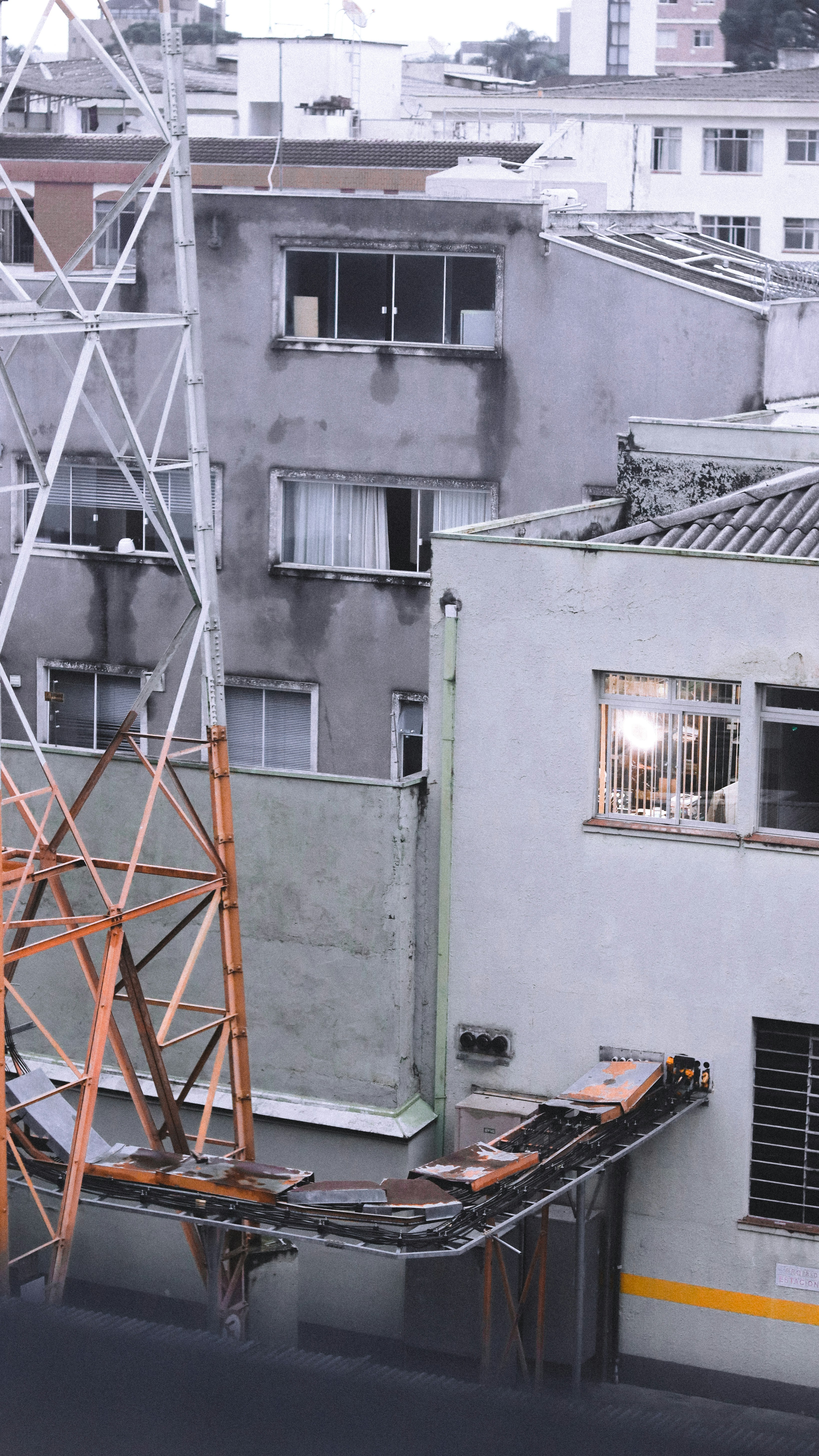 A fire hydrant on the side of a building photo – Free City Image on ...