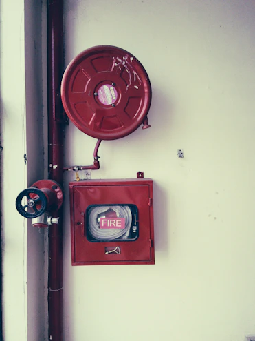 Close-up of a fire hose reel ready for deployment.