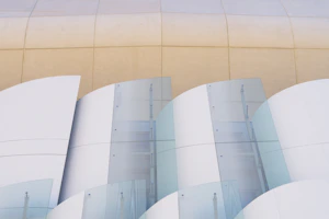 Shimmering glass panels and fittings displayed against a clean white background.