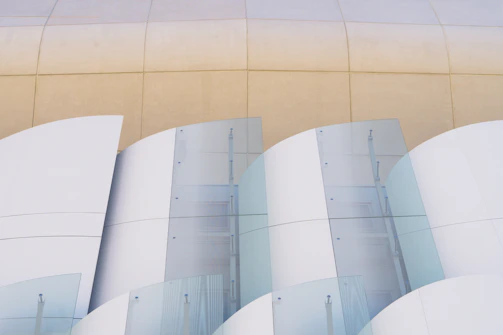 Shimmering glass panels and fittings displayed against a clean white background.
