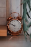 an alarm clock sitting on top of a table