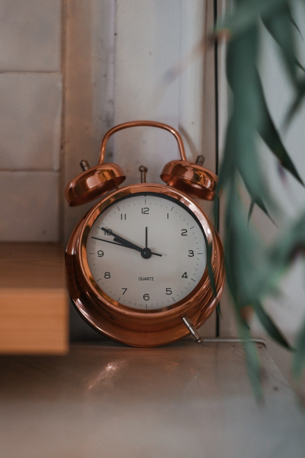 an alarm clock sitting on top of a table