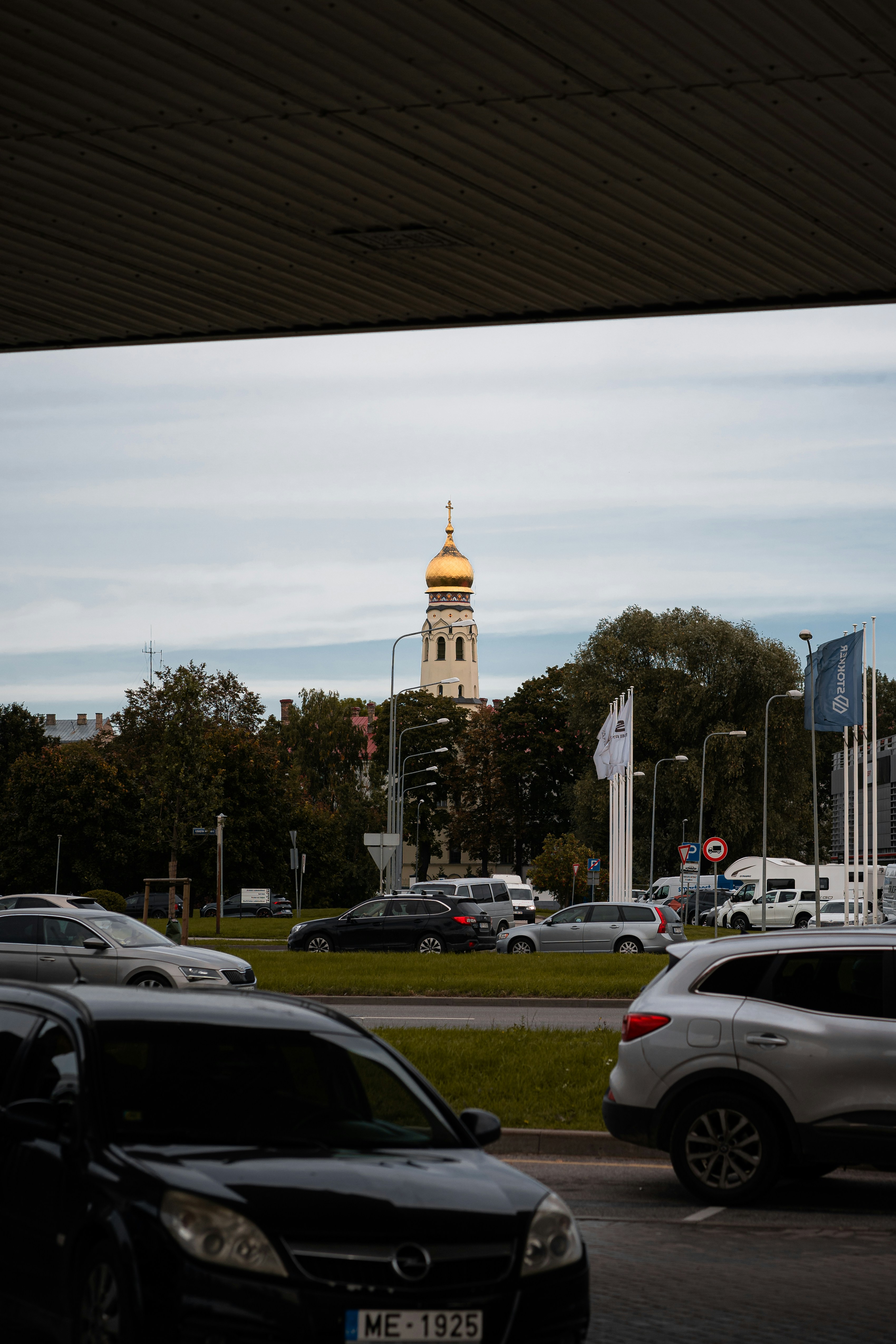 a view of a clock tower from a parking lot