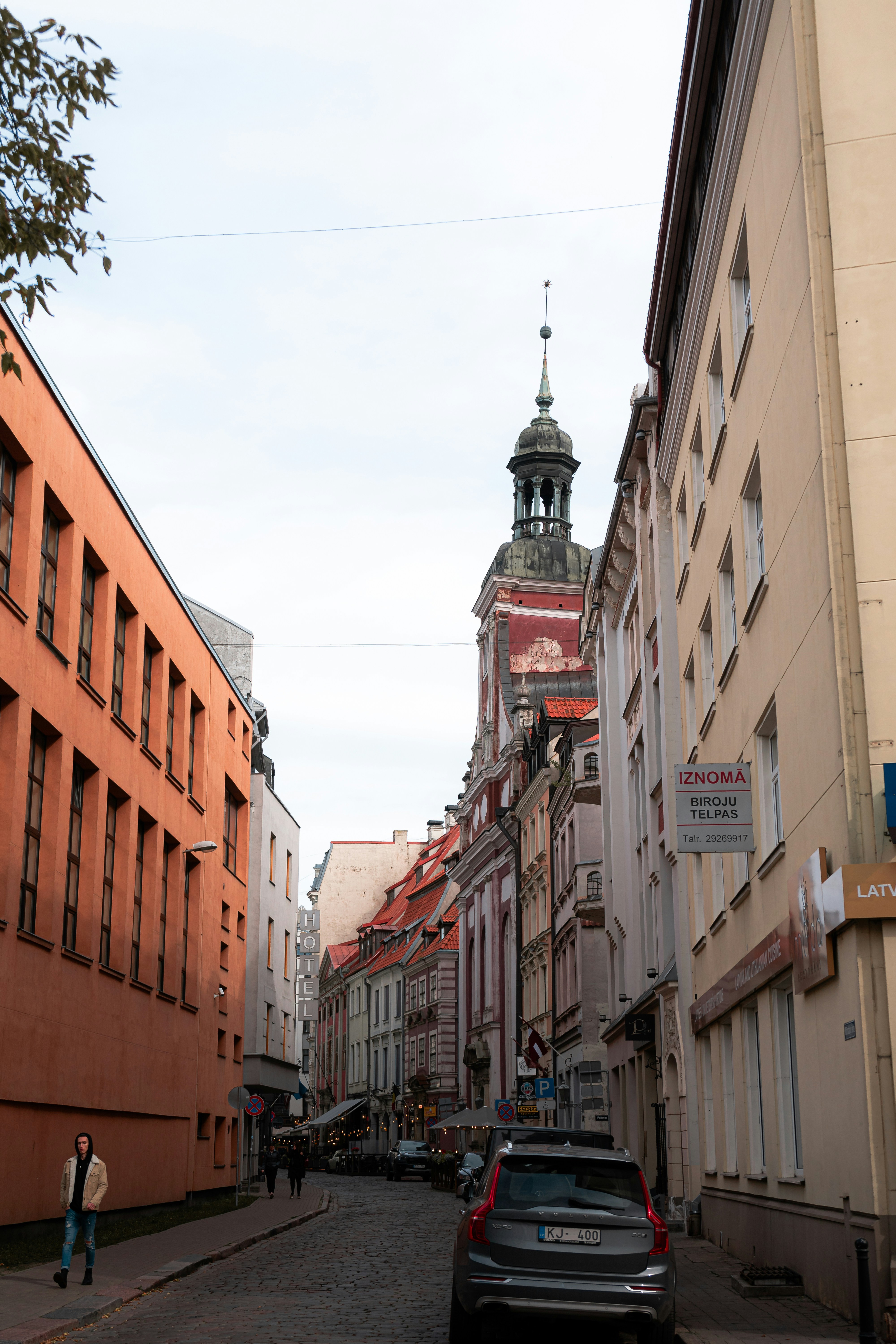 a city street with cars parked on the side of it