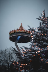 a christmas tree with a tower in the background