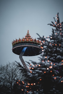 a christmas tree with a tower in the background