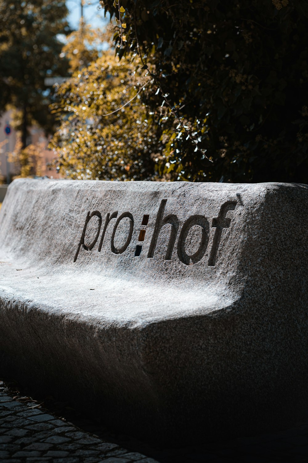 a stone bench with the word prof written on it